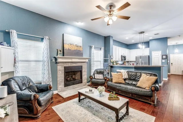 a living room with furniture and a fireplace