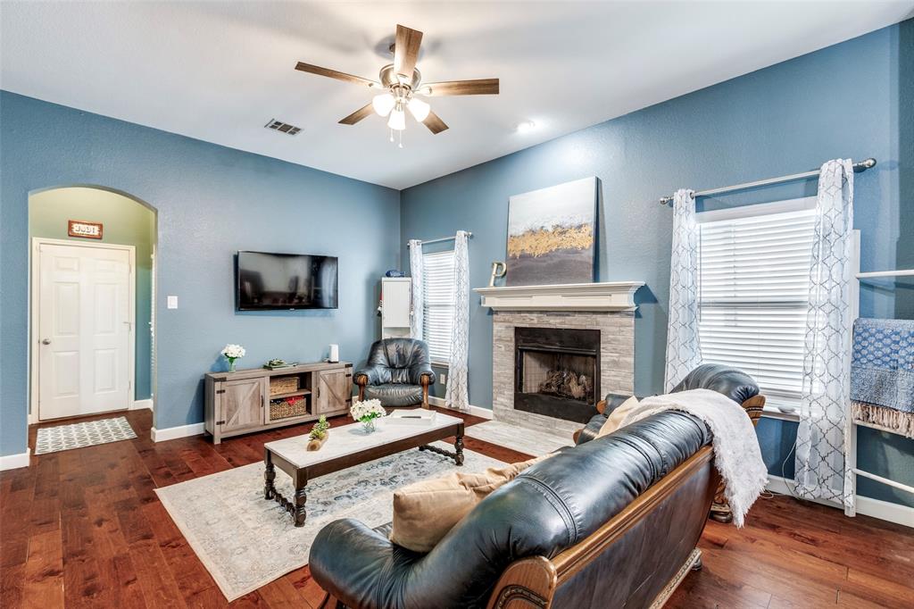 1712 Jasmine Trail Savannah, TX 76227 - Photo 8 of 21 a living room with furniture and a fireplace