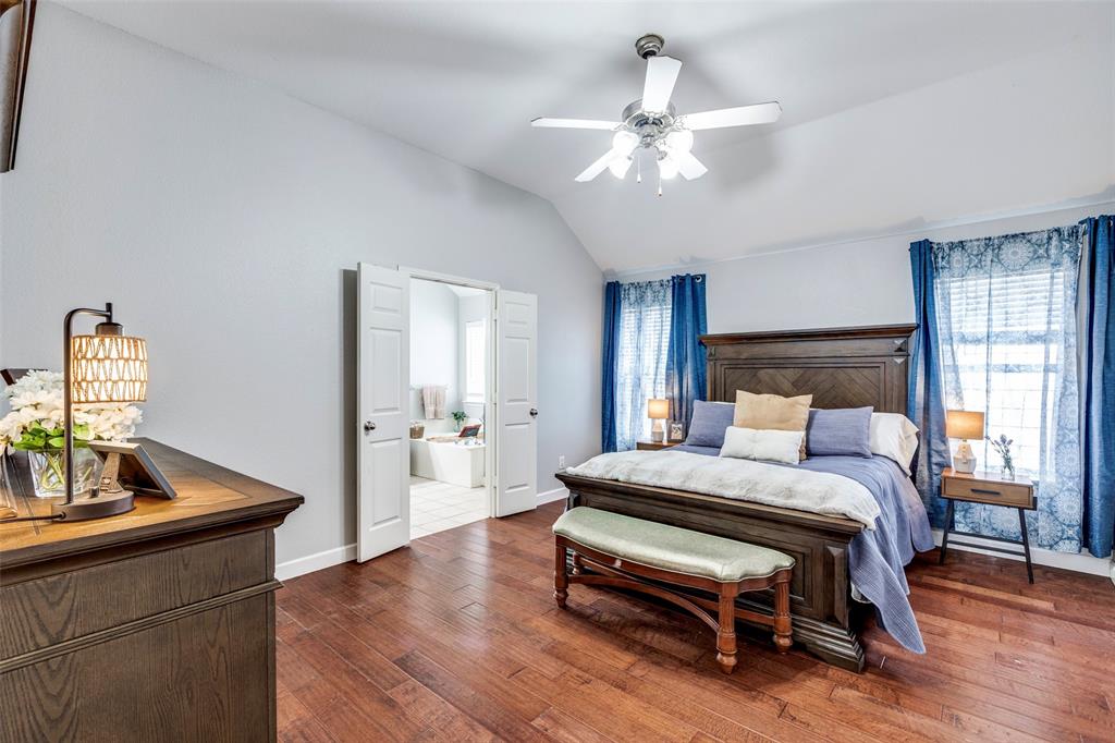 1712 Jasmine Trail Savannah, TX 76227 - Photo 10 of 21 a bedroom with a bed table and window