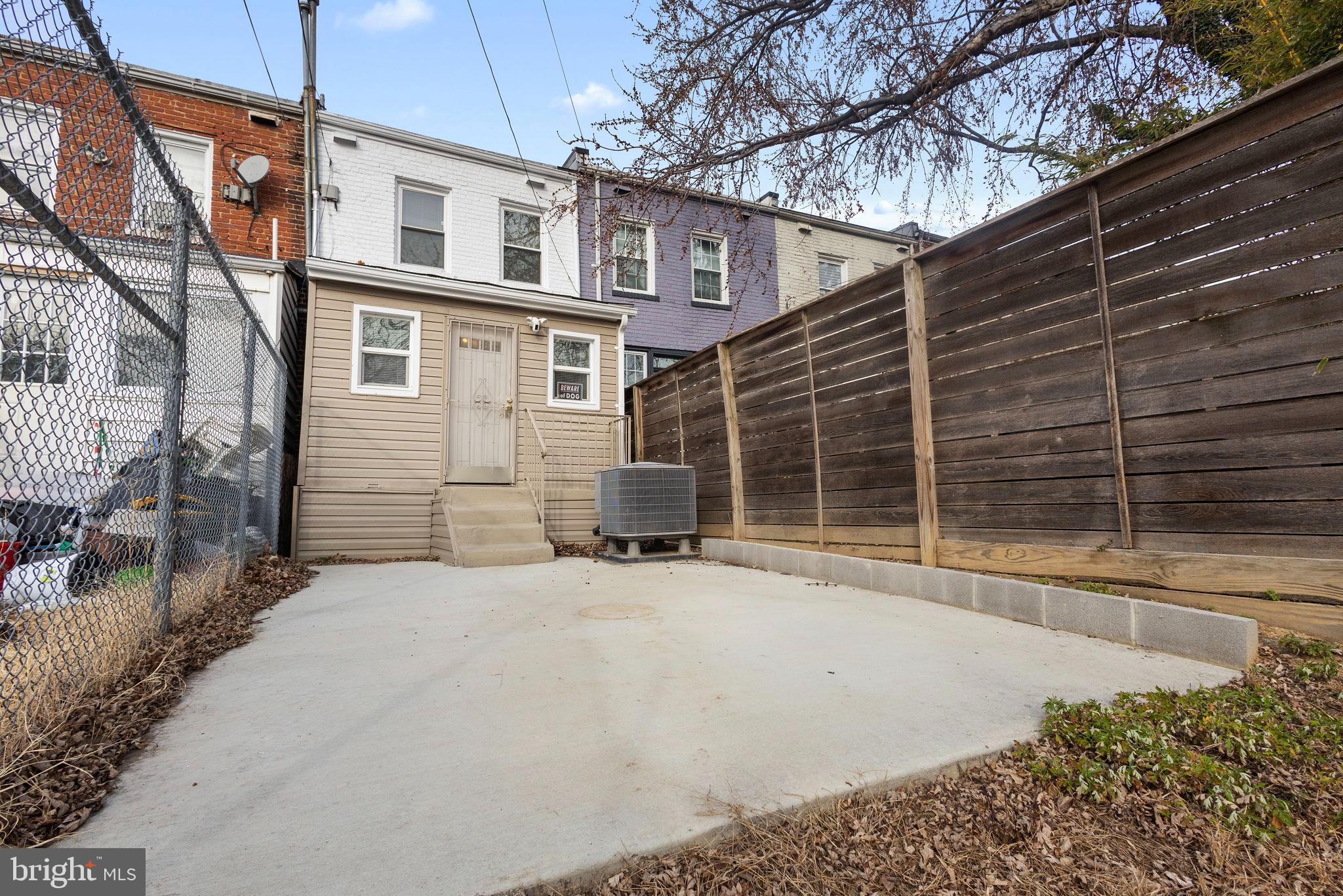 1841 L Street Northeast Washington, DC 20002 - Photo 22 of 31 a front view of a house with a yard and garage
