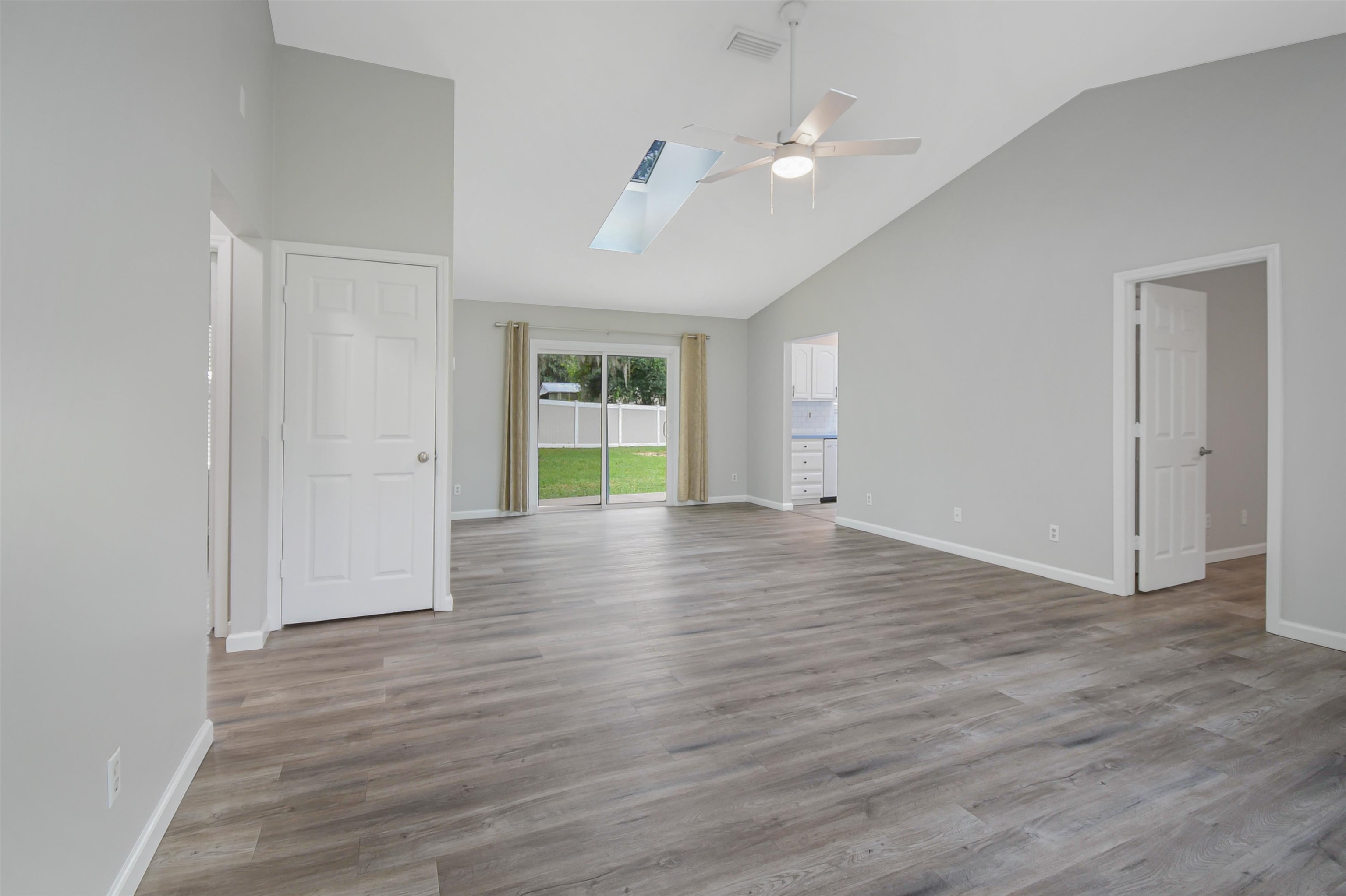 1196 Brookside Court St. Augustine, FL 32086 - Photo 12 of 29 wooden floor in an empty room with a window