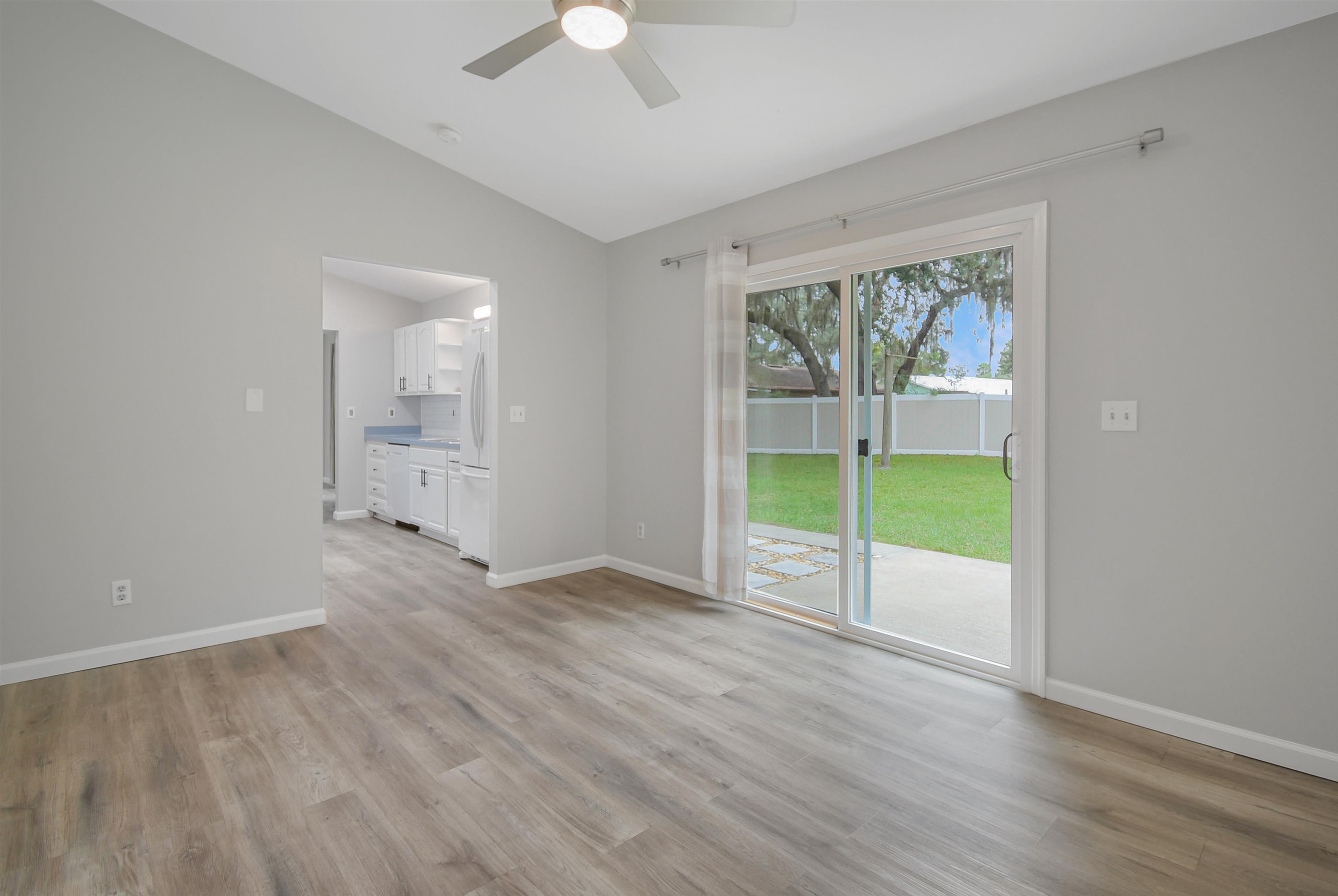 1196 Brookside Court St. Augustine, FL 32086 - Photo 13 of 29 an empty room with wooden floor and windows