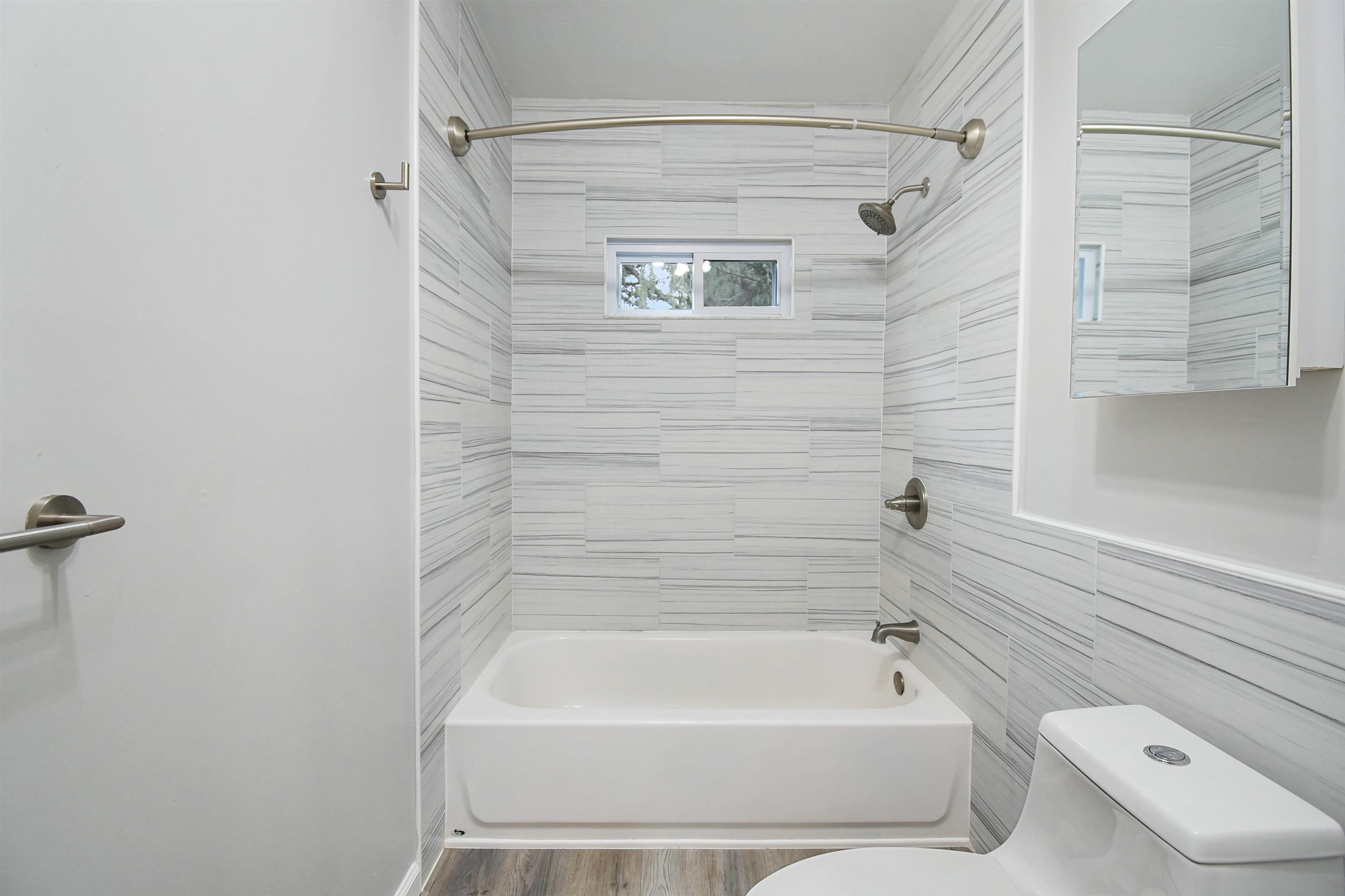 1196 Brookside Court St. Augustine, FL 32086 - Photo 17 of 29 a bathroom with a toilet and a bathtub