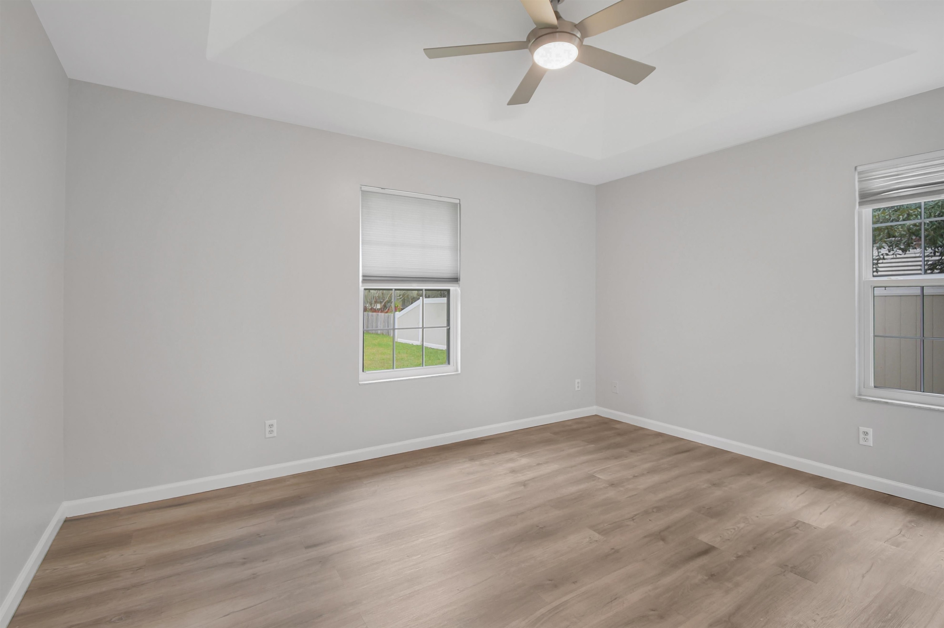 1196 Brookside Court St. Augustine, FL 32086 - Photo 18 of 29 wooden floor in an empty room with a window