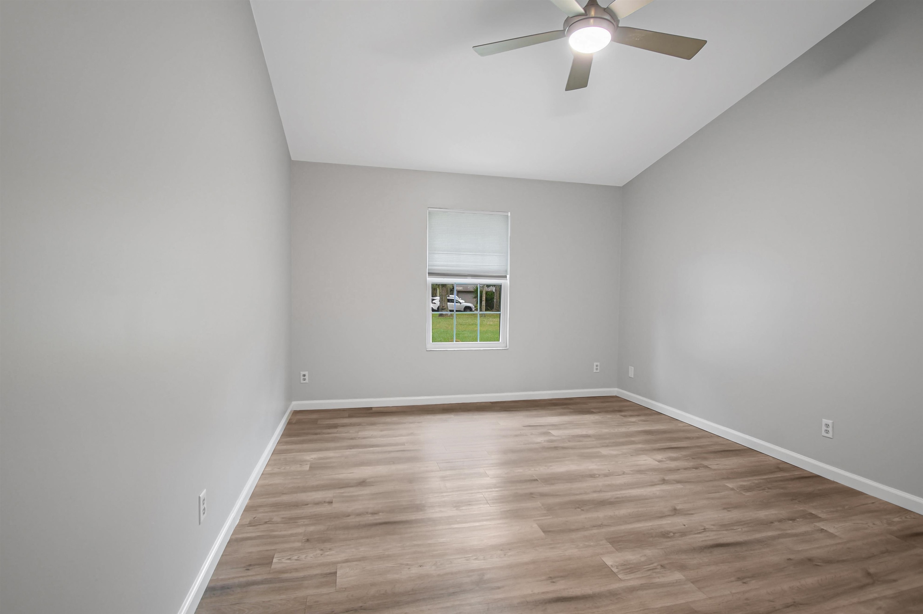 1196 Brookside Court St. Augustine, FL 32086 - Photo 27 of 29 wooden floor in an empty room with a window