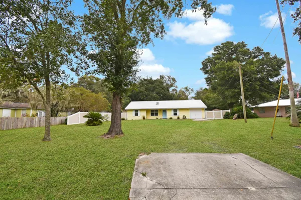 a view of backyard with green space