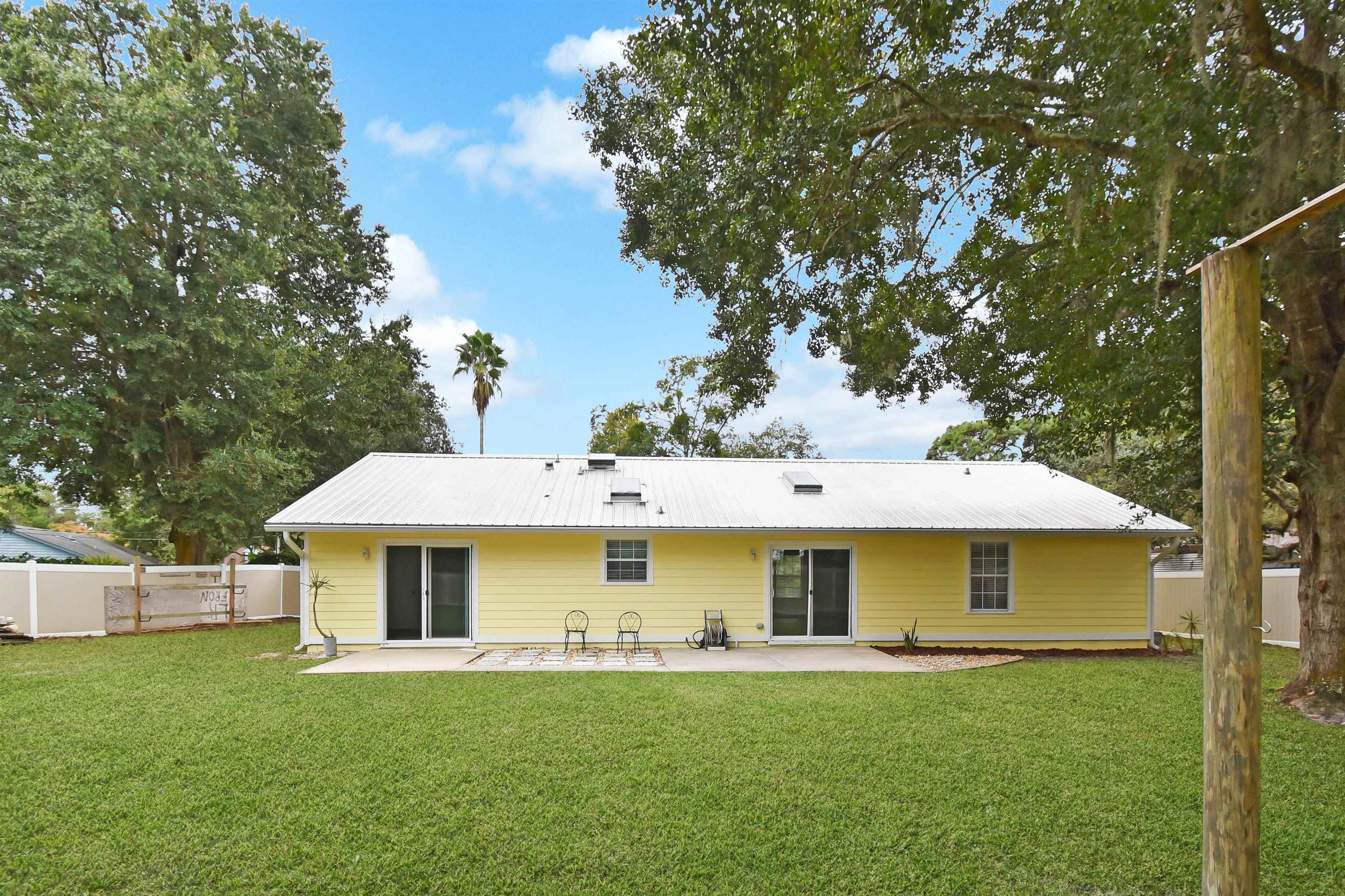 1196 Brookside Court St. Augustine, FL 32086 - Photo 7 of 29 a view of a yard with a house and a garden