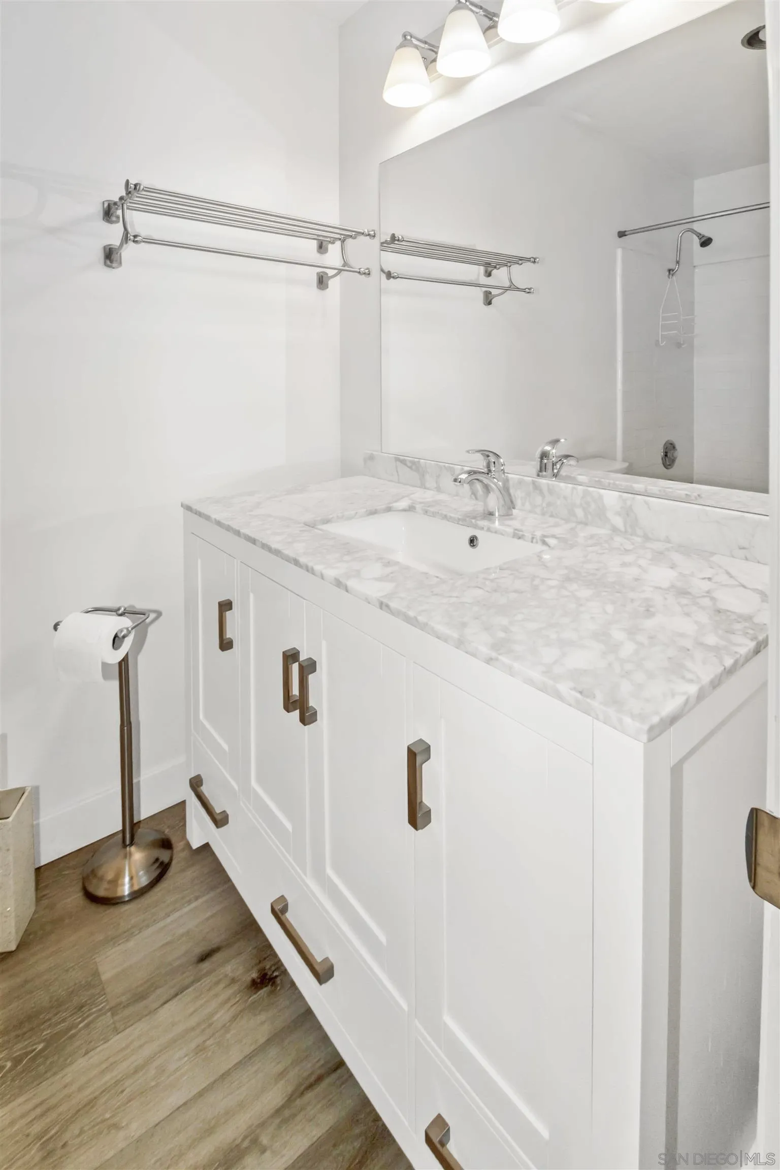 502 E Avenue Coronado, CA 92118 - Photo 12 of 18 a bathroom with a sink and a mirror