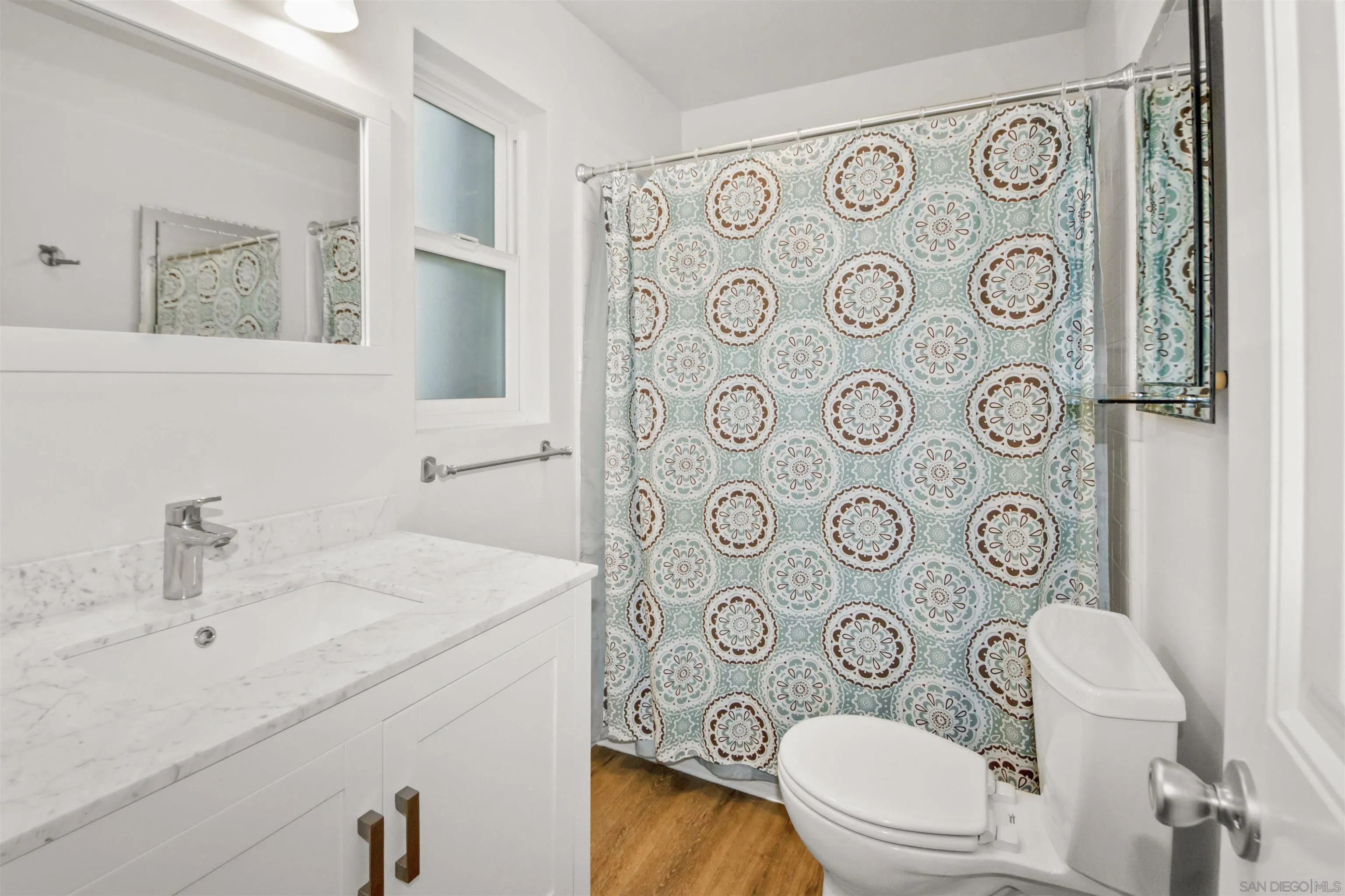502 E Avenue Coronado, CA 92118 - Photo 15 of 18 a bathroom with a sink and a toilet