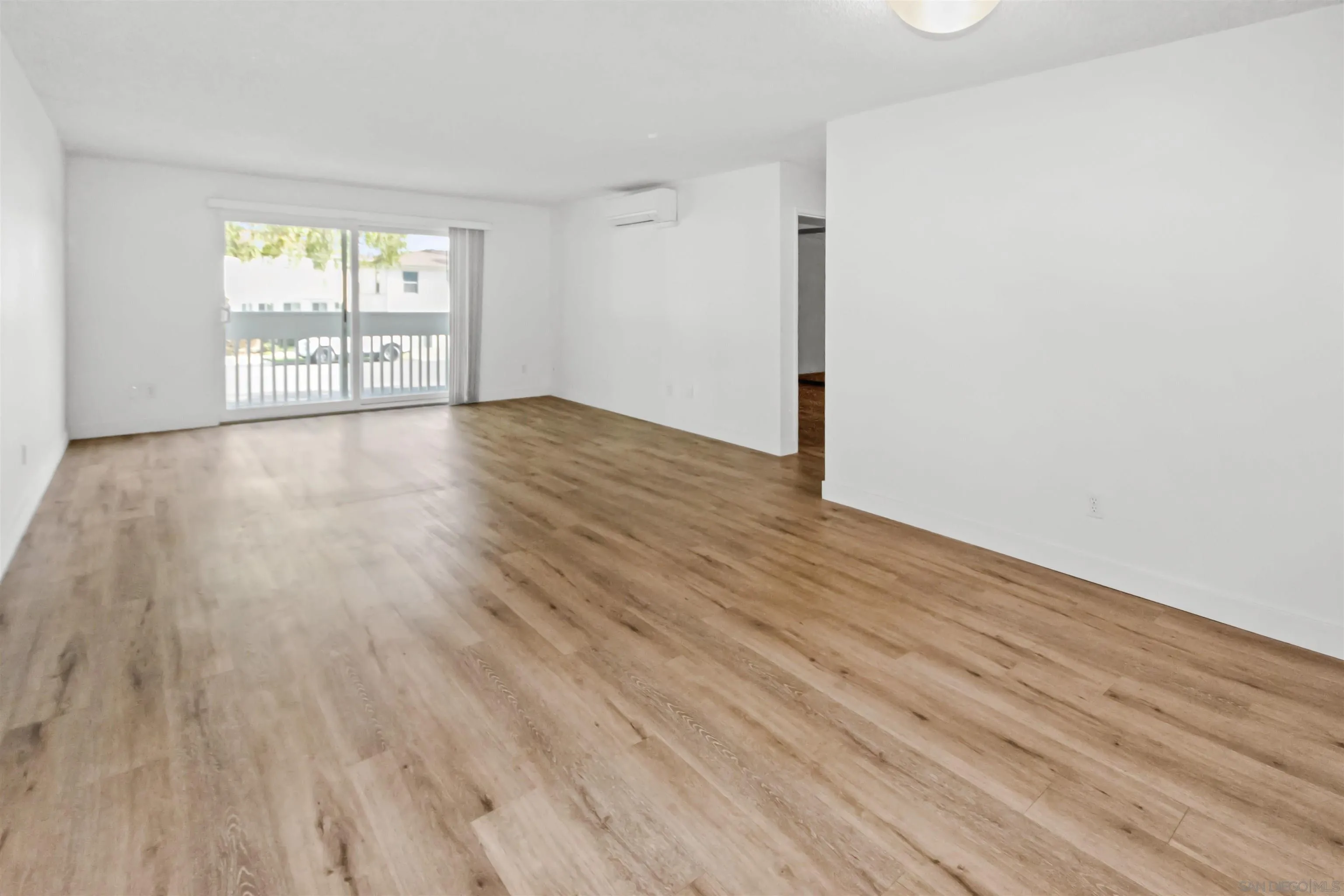 502 E Avenue Coronado, CA 92118 - Photo 4 of 18 wooden floor in an empty room with a window