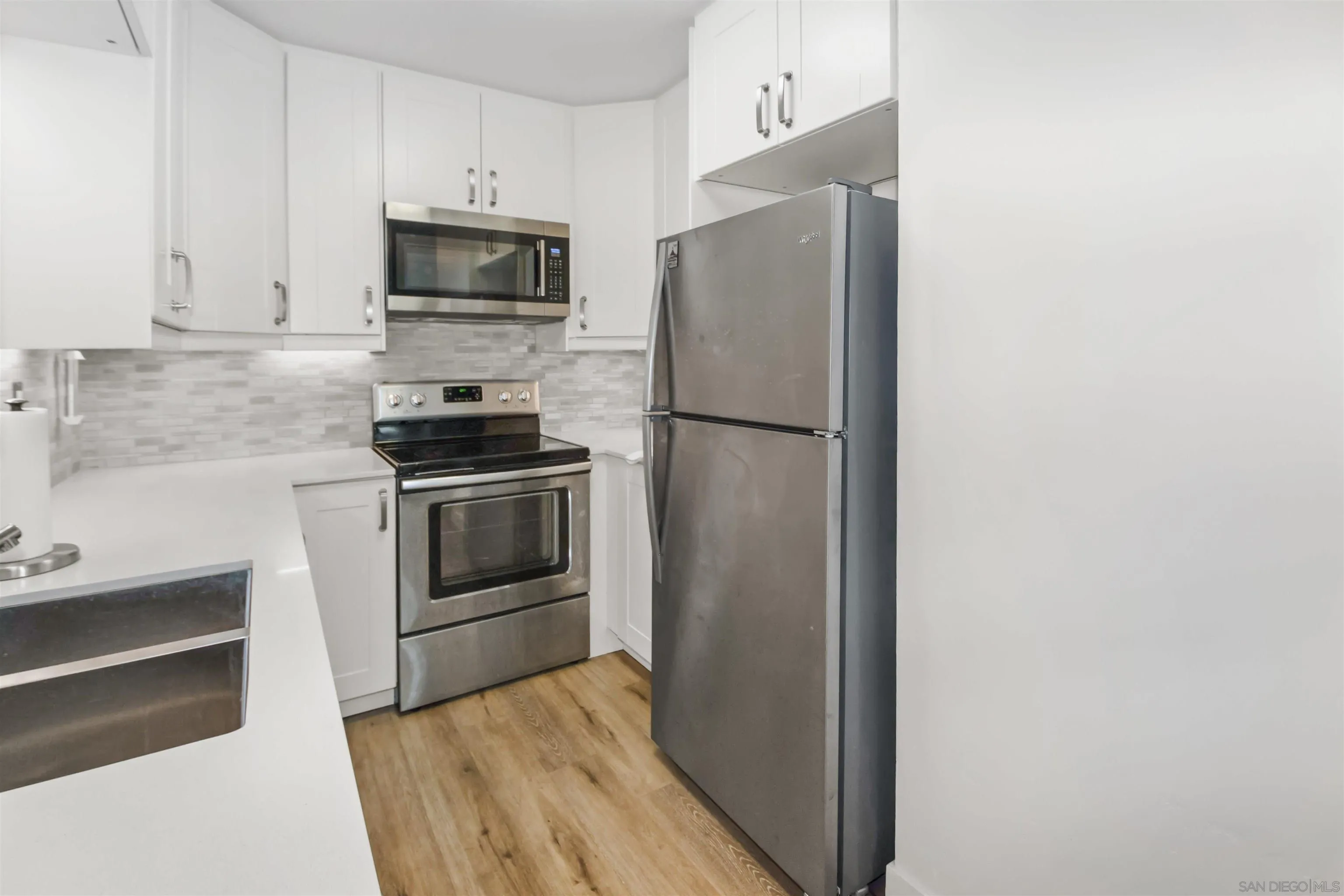 502 E Avenue Coronado, CA 92118 - Photo 9 of 18 a kitchen with a refrigerator stove and microwave