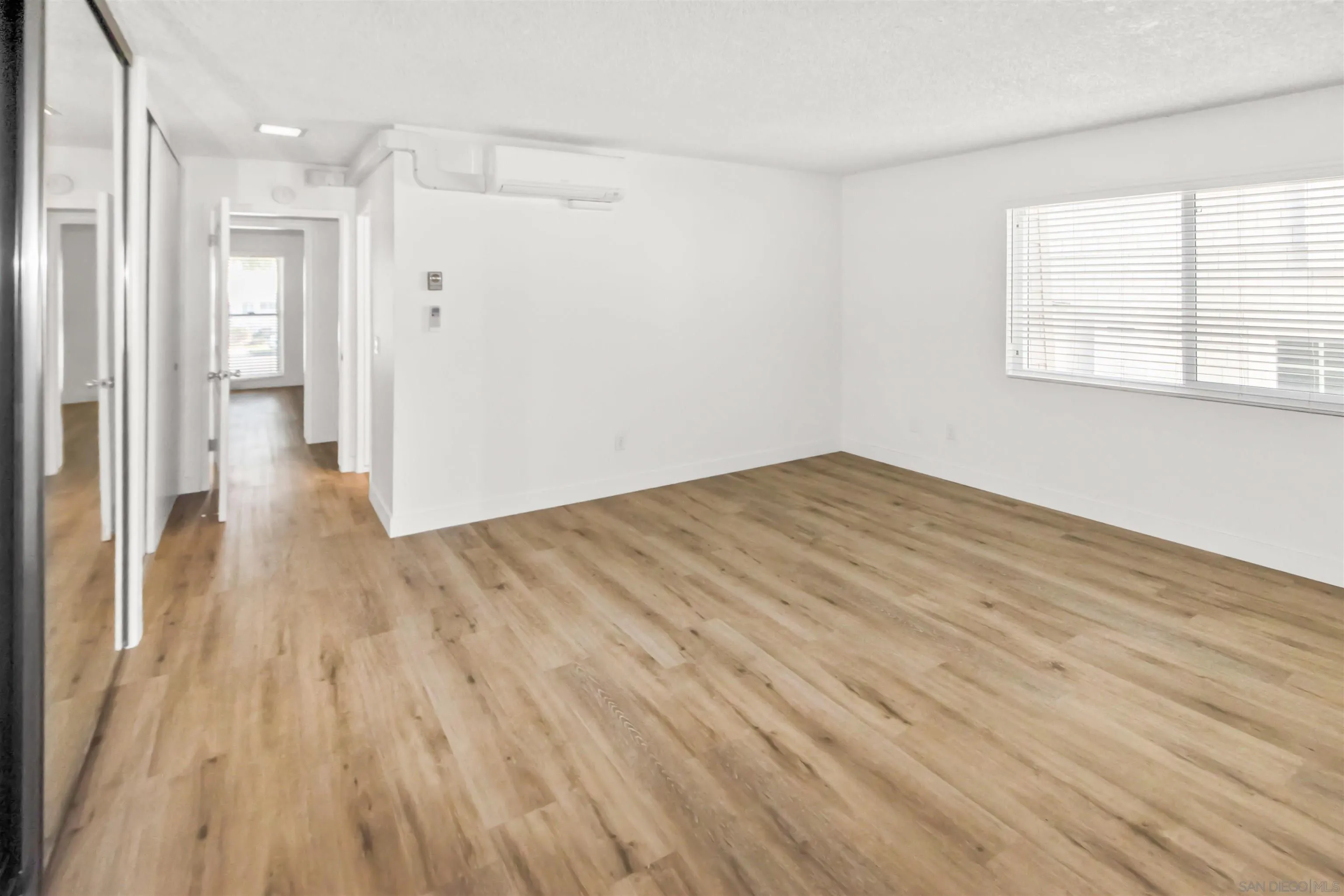502 E Avenue Coronado, CA 92118 - Photo 10 of 18 a view of empty room with wooden floor and fan