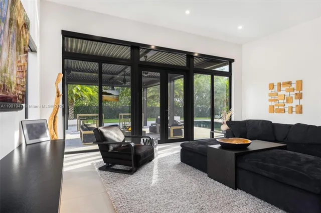 a kitchen with a table chairs refrigerator and sink
