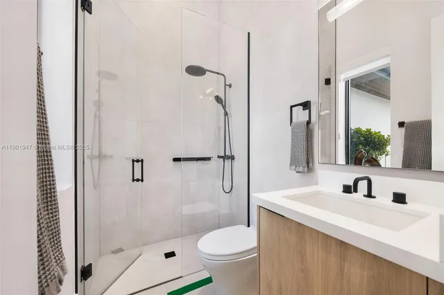 a very nice looking room with a large window and chandelier