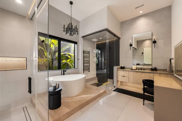 a living room with patio furniture and a floor to ceiling window