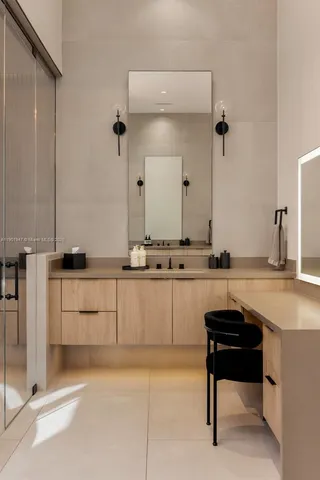 a living room with patio furniture and a garden