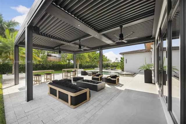 a outdoor dining space with furniture and outdoor view