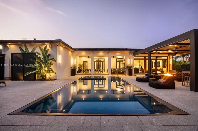 a view of a swimming pool with a patio