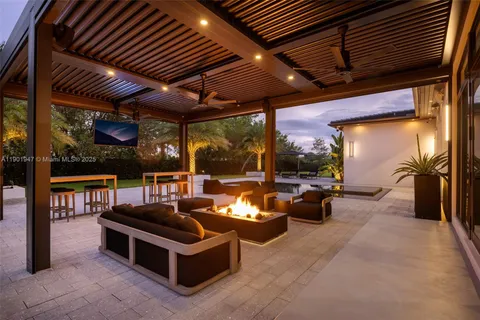 a view of a house with swimming pool and a yard