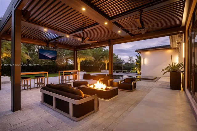 a view of a house with swimming pool and a yard