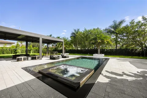 an aerial view of a house with a garden