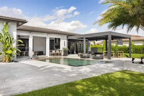 an aerial view of a house with outdoor space swimming pool and outdoor seating