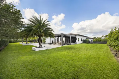 an aerial view of a house having swimming pool