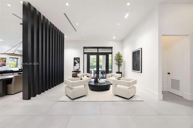 a view of a living room and entryway