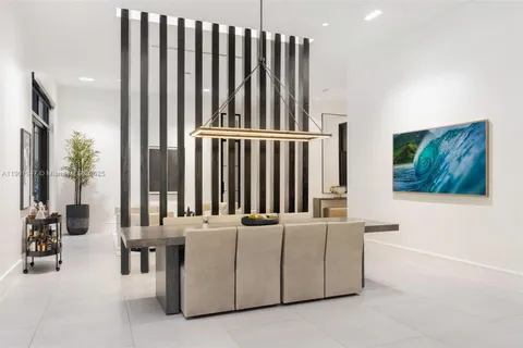 a large kitchen with a large counter top appliances and cabinets