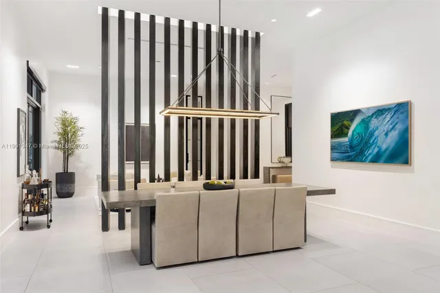 a large kitchen with a large counter top appliances and cabinets