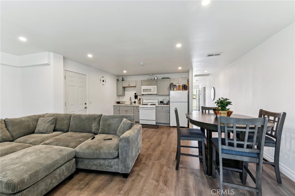 9320 Long Beach Boulevard South Gate, CA 90280 - Photo 12 of 30 a living room with furniture kitchen view and a dining table