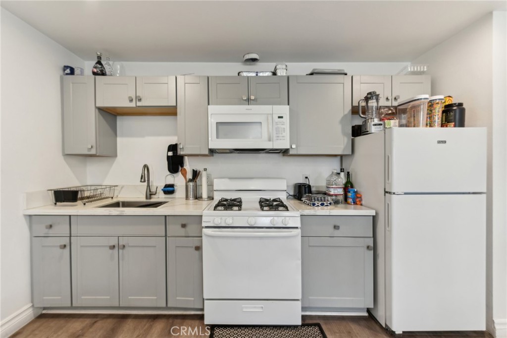 9320 Long Beach Boulevard South Gate, CA 90280 - Photo 16 of 30 a kitchen with cabinets appliances and a sink