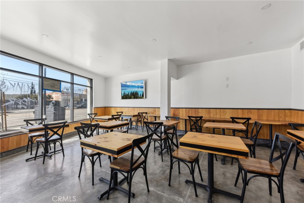 9320 Long Beach Boulevard South Gate, CA 90280 - Photo 25 of 30 a view of a dining room with furniture and wooden floor
