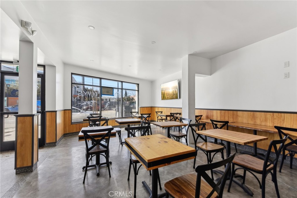 9320 Long Beach Boulevard South Gate, CA 90280 - Photo 26 of 30 a living room with furniture a large window and a table