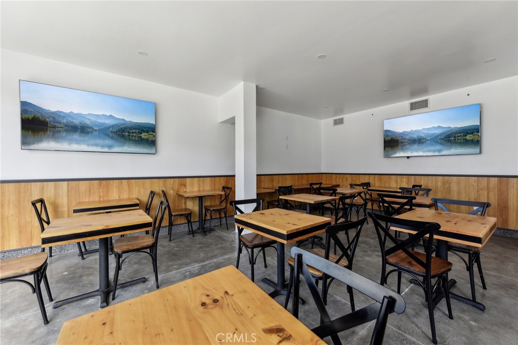 9320 Long Beach Boulevard South Gate, CA 90280 - Photo 29 of 30 a view of a dining room with furniture and chandelier