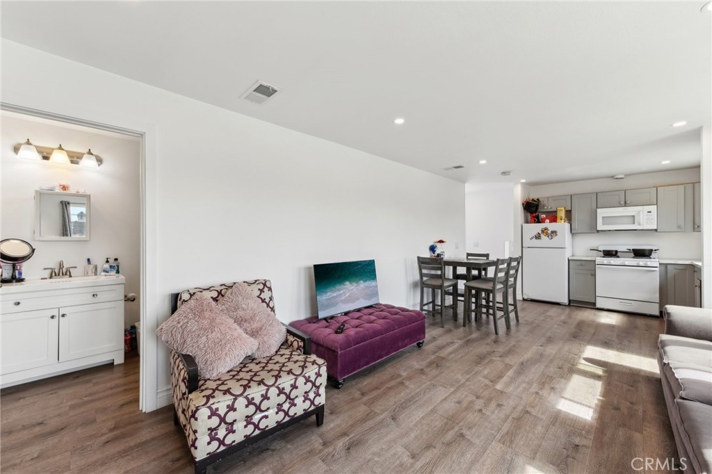 9320 Long Beach Boulevard South Gate, CA 90280 - Photo 6 of 30 a living room with furniture and wooden floor