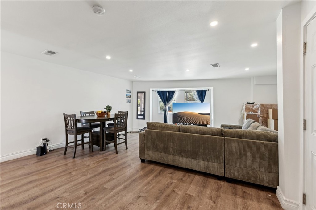 9320 Long Beach Boulevard South Gate, CA 90280 - Photo 8 of 30 a living room with furniture and a wooden floor