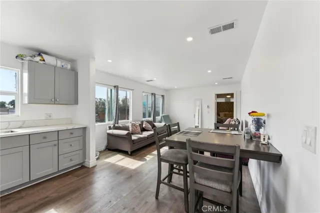 a view of a livingroom with furniture and wooden floor