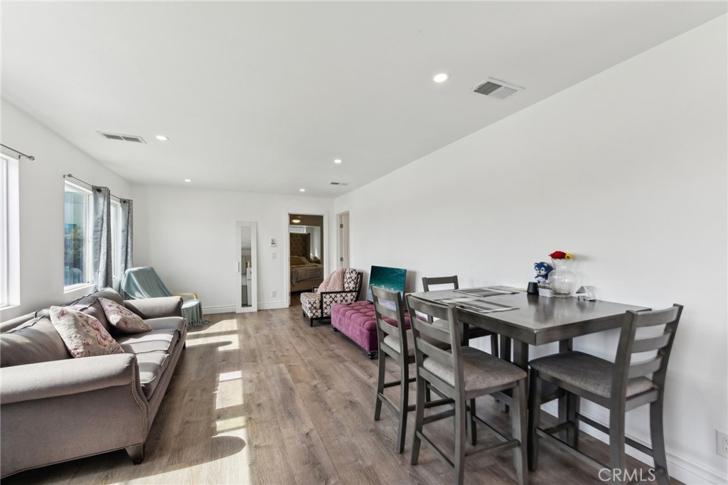 9320 Long Beach Boulevard South Gate, CA 90280 - Photo 10 of 30 a view of a livingroom with furniture and wooden floor