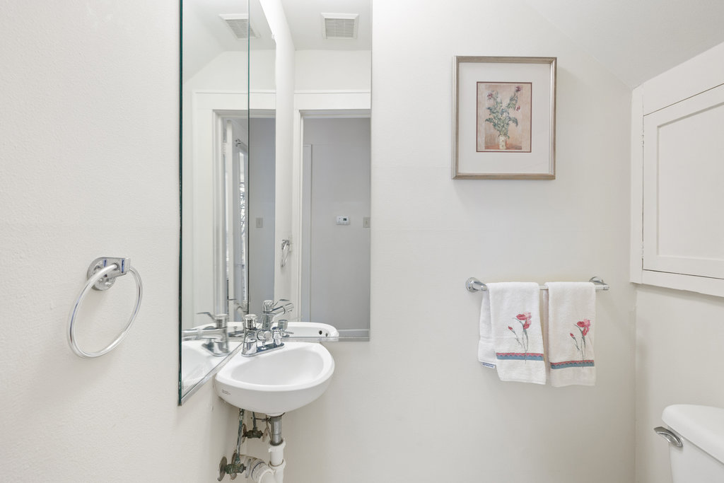 1609 Wethersfield Road Austin, TX 78703 - Photo 16 of 38 Bathroom featuring toilet and a sink