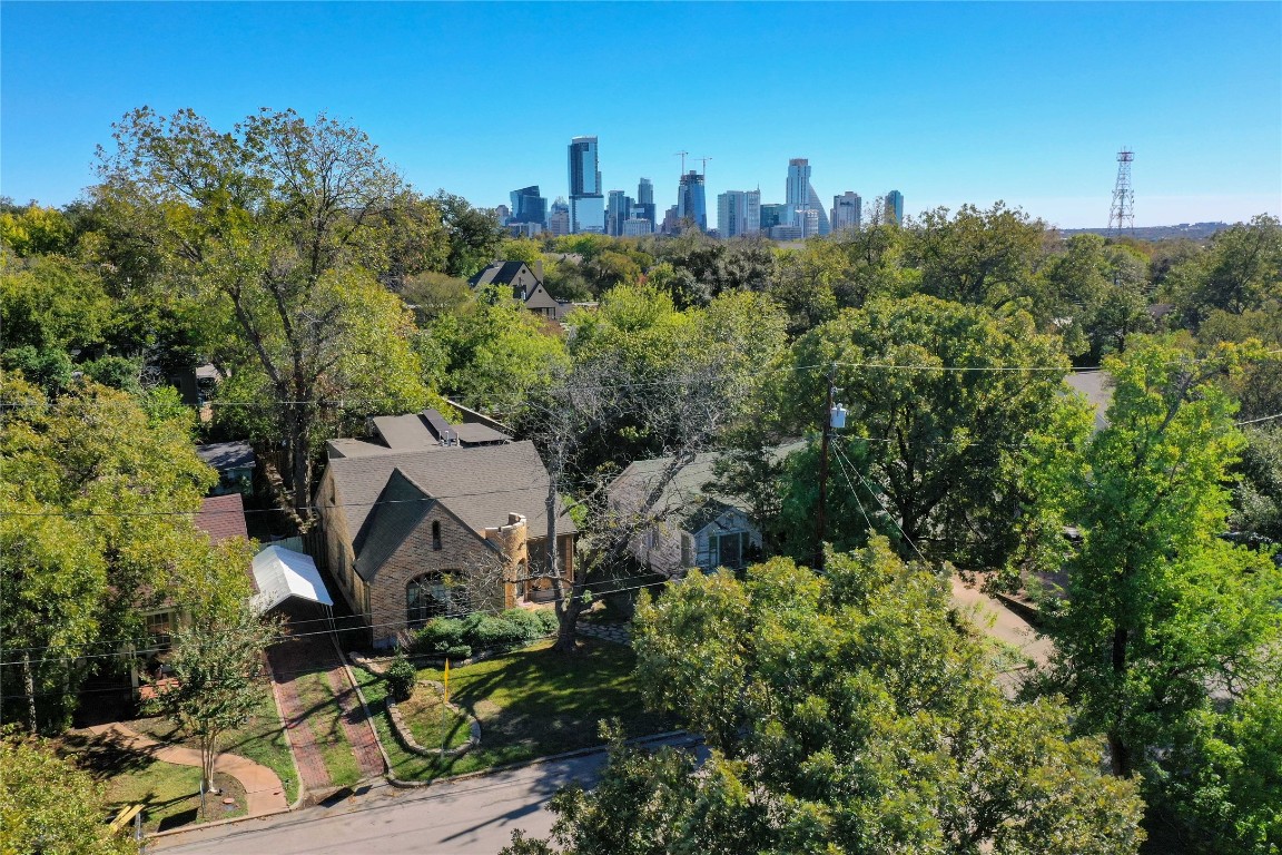 1609 Wethersfield Road Austin, TX 78703 - Photo 3 of 38 Aerial view of property and surrounding area featuring a tree filled landscape and Austin skyline