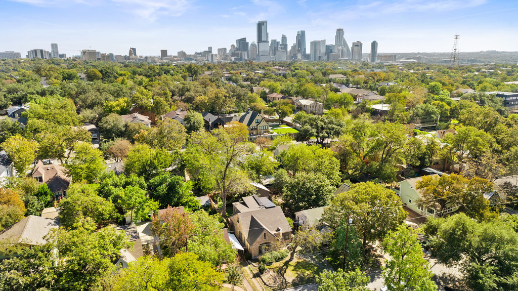 1609 Wethersfield Road Austin, TX 78703 - Photo 34 of 38 Aerial view of skyline and a tree filled landscape