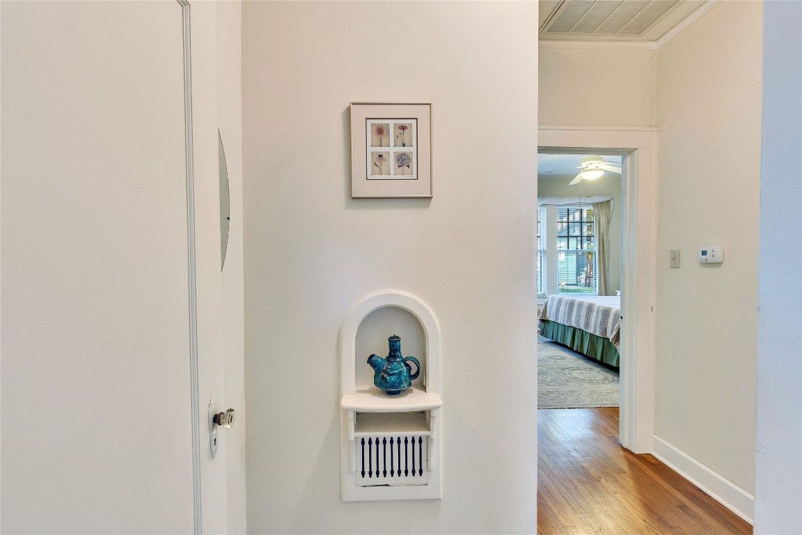 1609 Wethersfield Road Austin, TX 78703 - Photo 6 of 38 Corridor with light wood-type flooring and crown molding