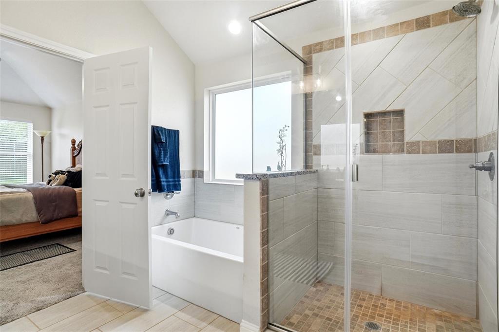 904 Avagail Avenue Springtown, TX 76082 - Photo 19 of 27 a bathroom with a tub shower and sink
