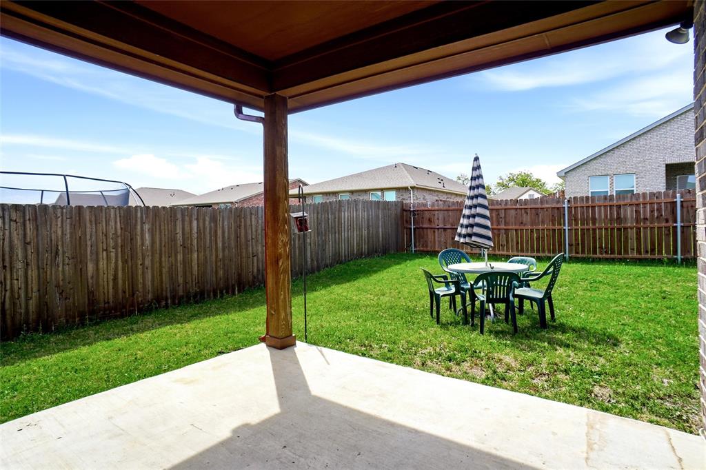 904 Avagail Avenue Springtown, TX 76082 - Photo 25 of 27 a view of a yard with a slide