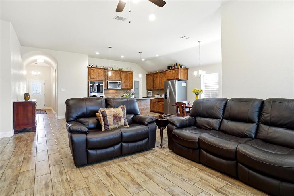 904 Avagail Avenue Springtown, TX 76082 - Photo 5 of 27 a living room with furniture and a wooden floor