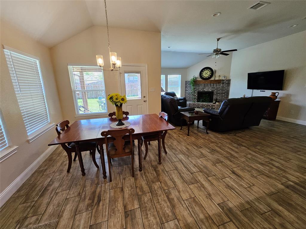 904 Avagail Avenue Springtown, TX 76082 - Photo 9 of 27 a living room with furniture and a flat screen tv