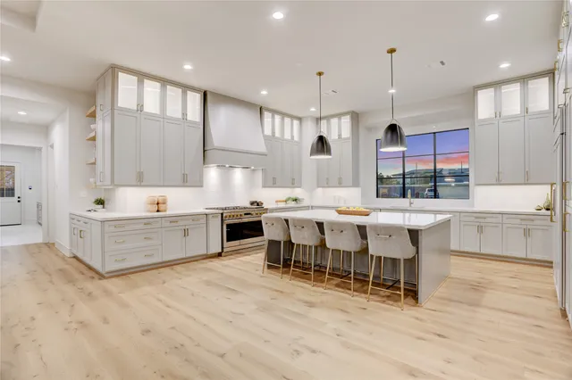 a large kitchen with lots of counter space and a sink