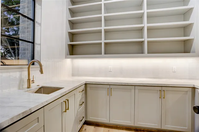 a kitchen with a sink and a cabinet