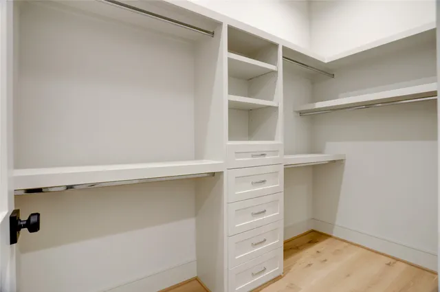 a view of an empty walk in closet